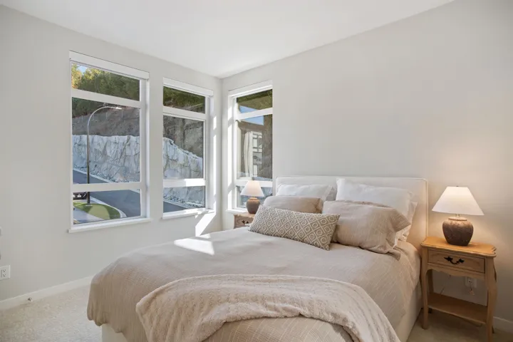 Carpeted bedroom featuring baseboards