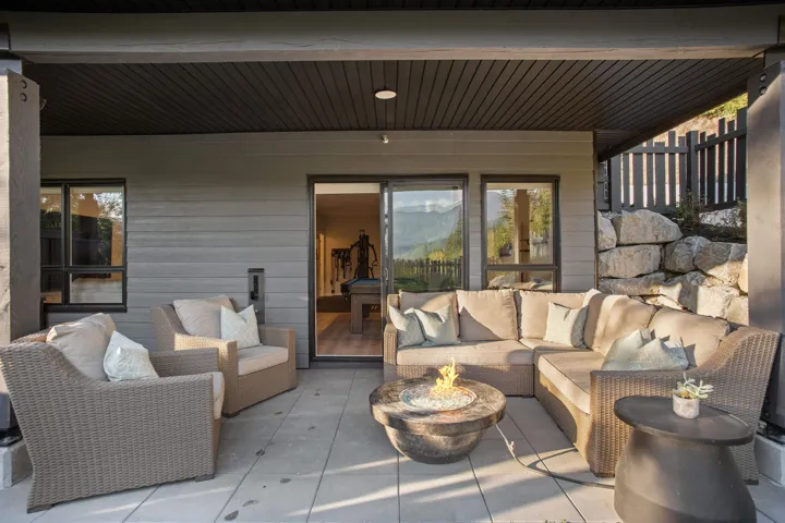 View of patio featuring an outdoor living space with a fire pit