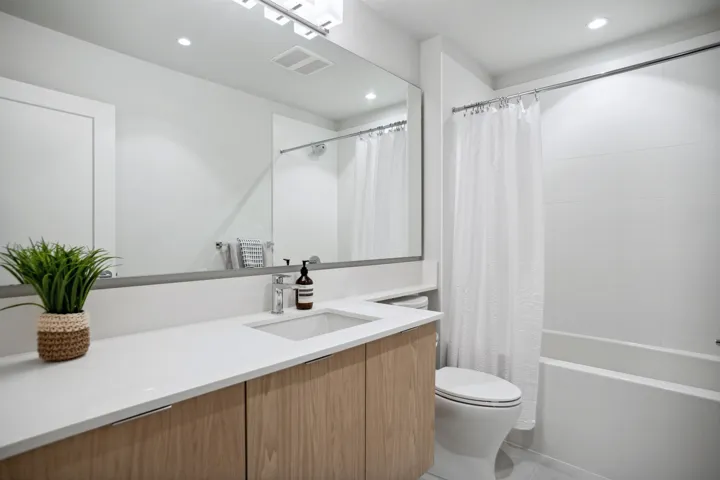 Bathroom featuring toilet, recessed lighting, shower / tub combo, vanity, and tile patterned flooring