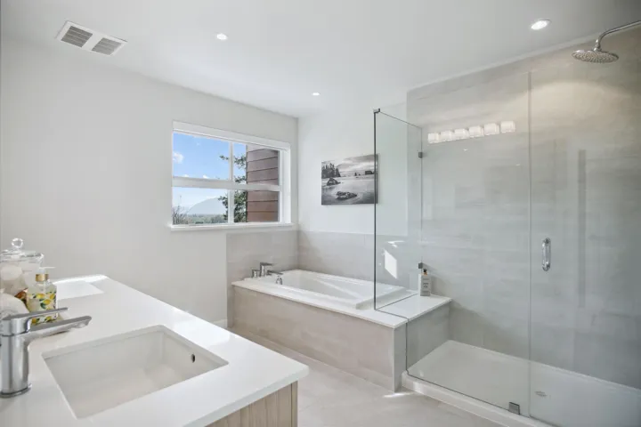 Bathroom with a sink, a shower stall, a garden tub, tile patterned floors, and recessed lighting