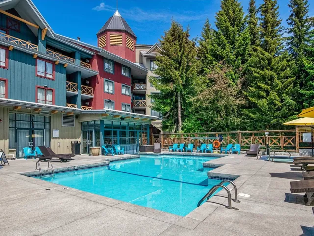 Community pool with a patio