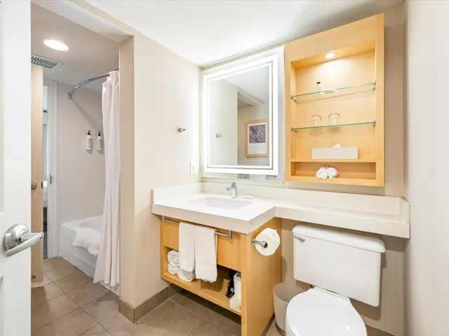 Bathroom with shower / bath combo with shower curtain, light tile patterned floors, vanity, and recessed lighting