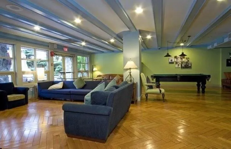 Building lobby featuring beamed ceiling