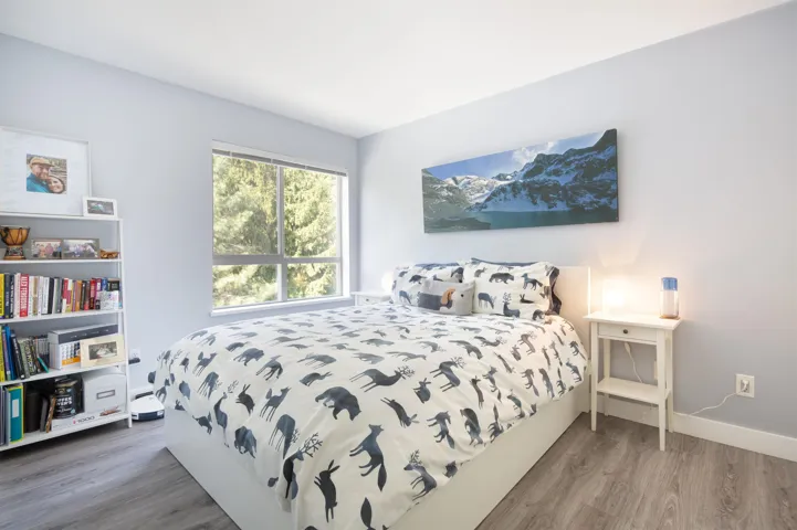Bedroom with baseboards and wood finished floors