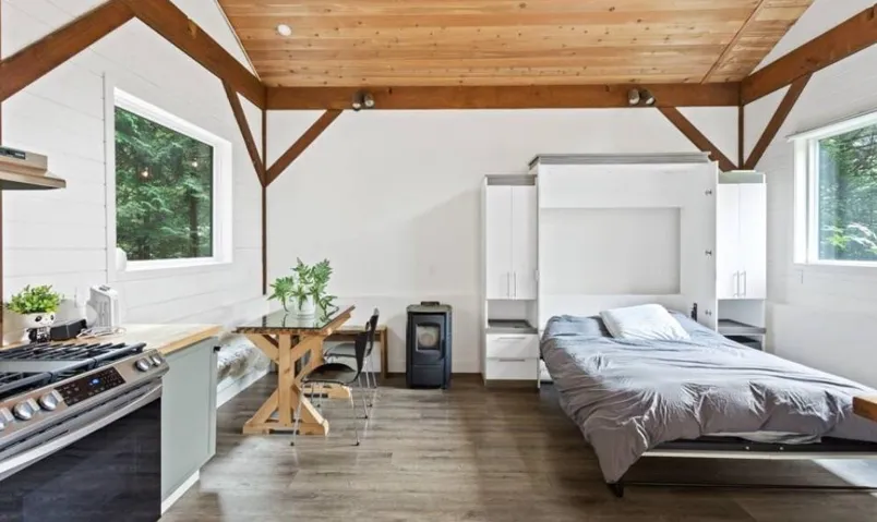 Bedroom with wood finished floors and wooden ceiling