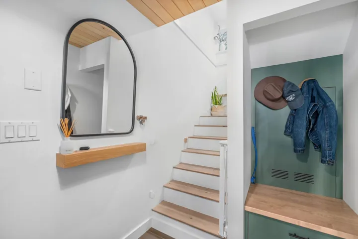 Stairs featuring baseboards and wood ceiling
