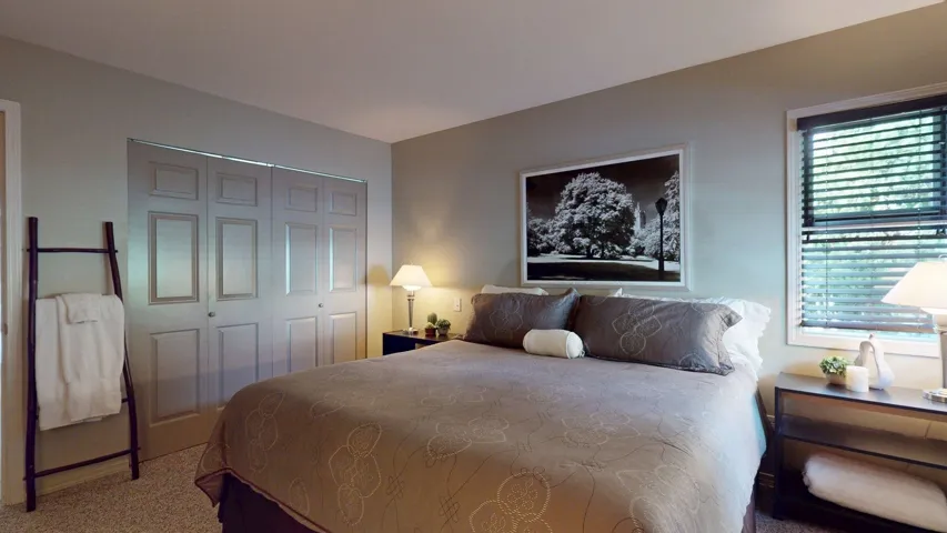 Bedroom featuring a closet and carpet flooring