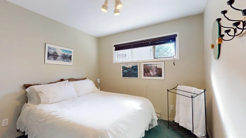 Bedroom with dark carpet