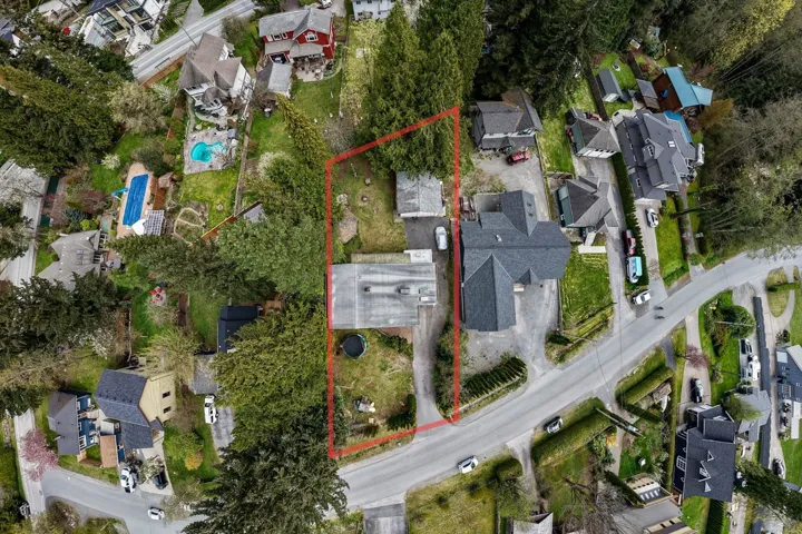 Aerial view of residential area with property parcel outlined