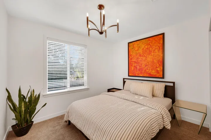 Bedroom featuring carpet floors and a chandelier