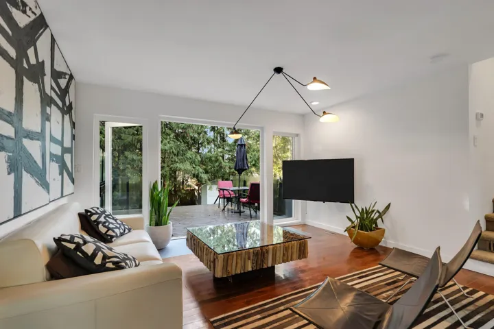 Living area featuring wood-type flooring and baseboards