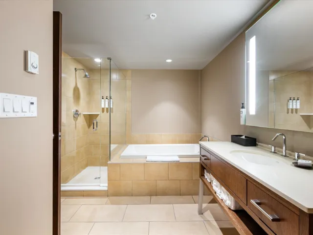 Bathroom featuring vanity, light tile patterned floors, a garden tub, a shower stall, and recessed lighting