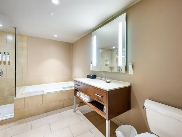 Full bath with a garden tub, vanity, a shower stall, light tile patterned floors, and recessed lighting