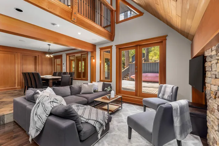 Living room featuring french doors, wood finished floors, high vaulted ceiling, and wood ceiling