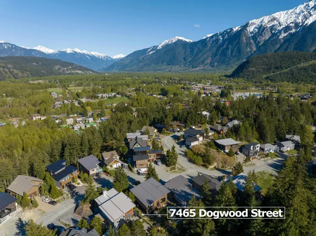 Aerial view of residential area featuring a mountain backdrop