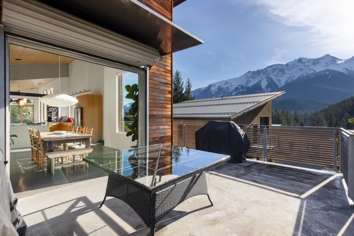 View of patio / terrace with a mountain view, outdoor dining area, and area for grilling