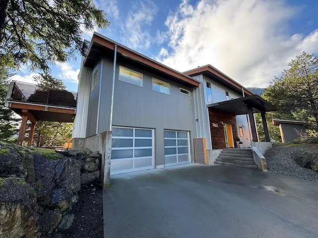 Modern home with an attached garage and driveway