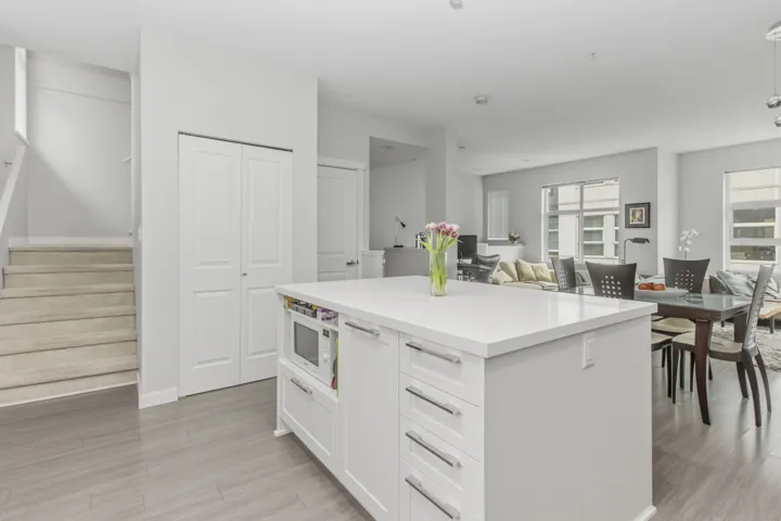 Spacious kitchen island featuring a light-colored countertop and integrated cabinetry
