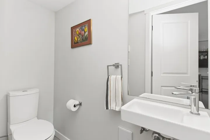 White rectangular wall-mounted sink with a chrome single-lever faucet