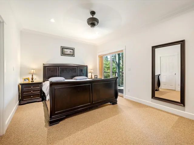 Bedroom featuring access to exterior, light colored carpet, crown molding, baseboards, and recessed lighting