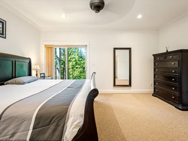 Bedroom with access to outside, light carpet, baseboards, ornamental molding, and ceiling fan