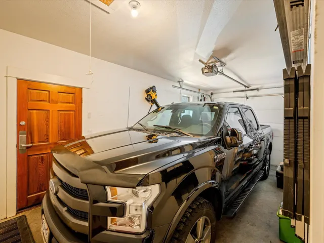 Garage featuring a garage door opener