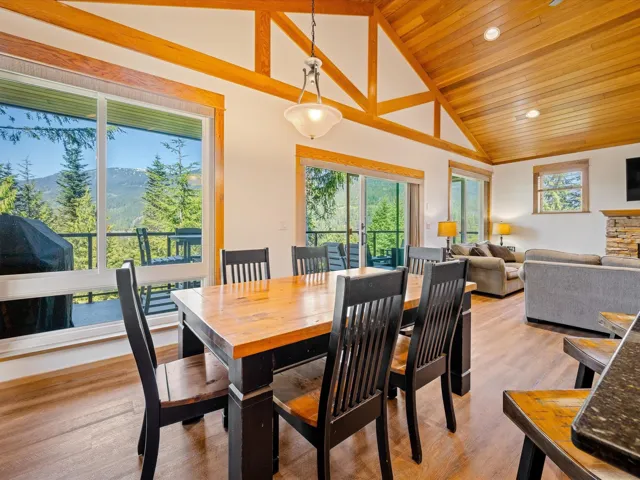 Dining space featuring healthy amount of natural light, wooden ceiling, light wood-style floors, recessed lighting, and high vaulted ceiling