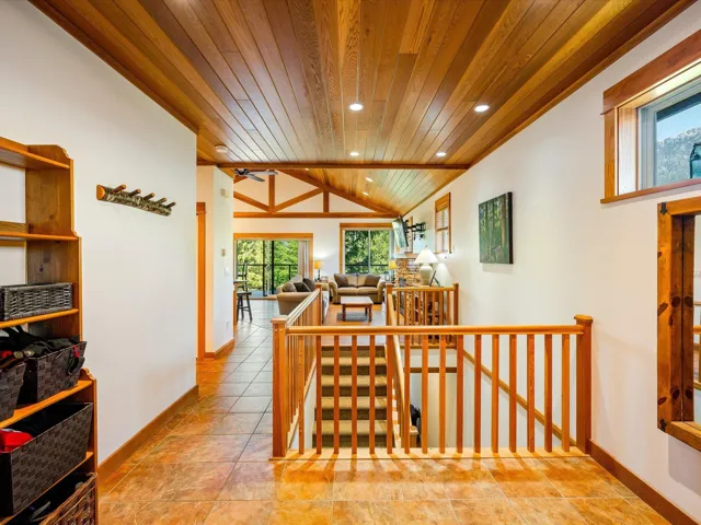 Hall with wood ceiling, an upstairs landing, lofted ceiling, recessed lighting, and baseboards