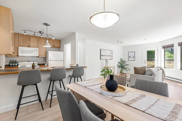 Dining room featuring rail lighting and light wood-style flooring