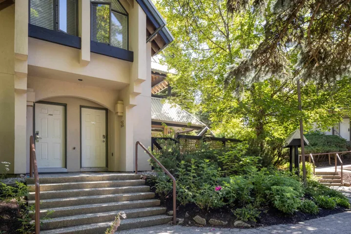 Property entrance featuring stucco siding