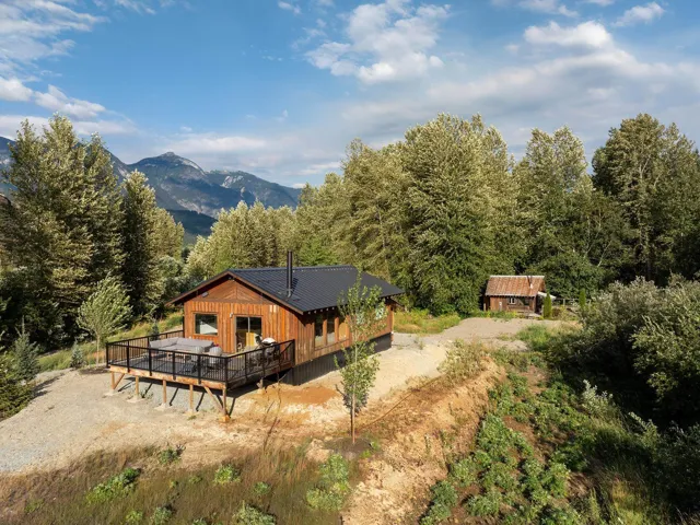 Back of property featuring a deck with mountain view