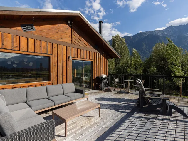 Deck featuring an outdoor living space, a mountain view, area for grilling, and outdoor dining area