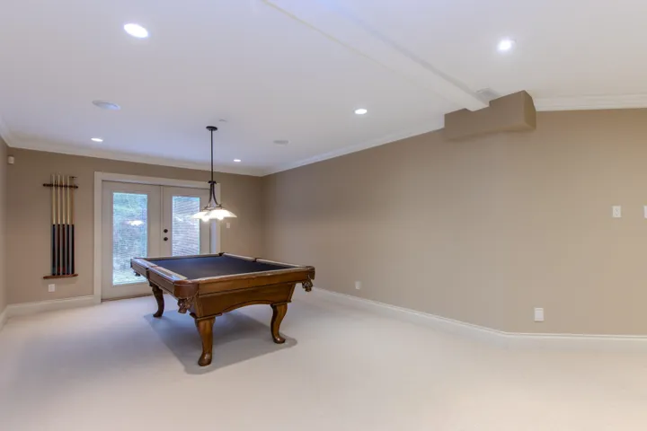 Playroom with crown molding, billiards table, french doors, light colored carpet, and recessed lighting