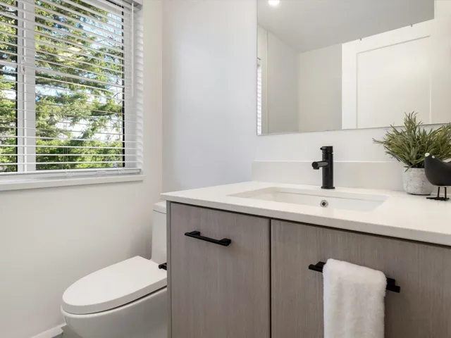 Half bath with vanity and toilet