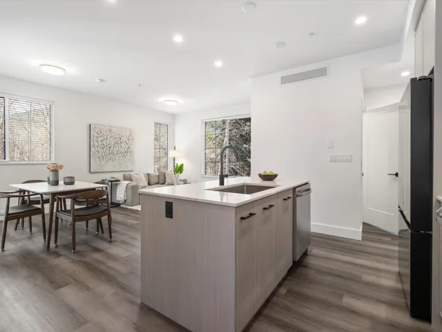 Kitchen featuring dark wood-style floors, a wealth of natural light, and a sink