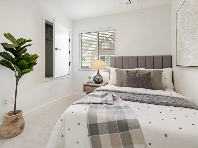 Carpeted bedroom with baseboards