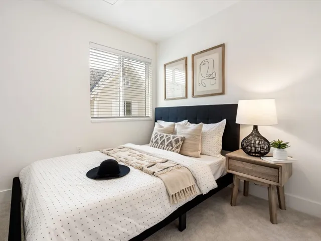 Carpeted bedroom with baseboards