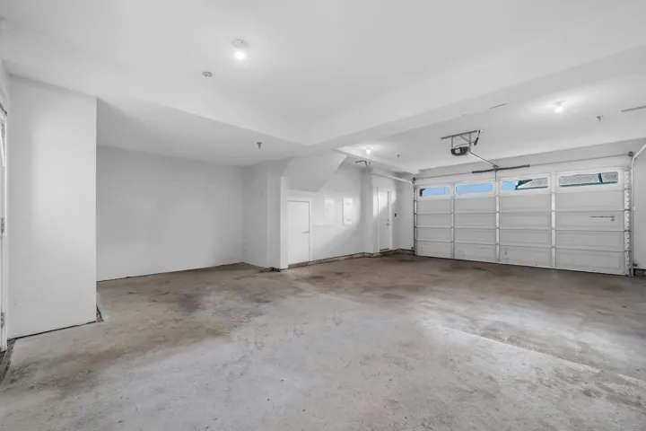 Wall-to-wall carpeting, bi-fold closet doors, and recessed lighting