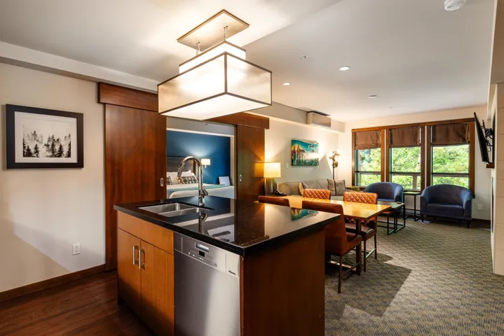 Modern open concept kitchen with island open to the dining and living area.