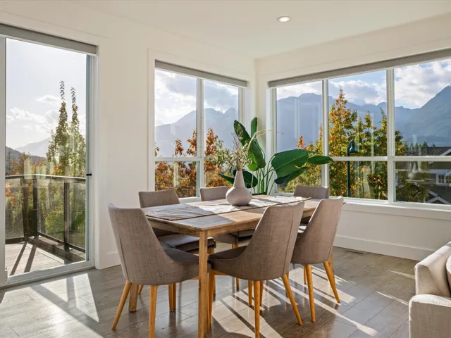 Sunroom featuring a mountain view, hardwood / wood-style floors, and recessed lighting