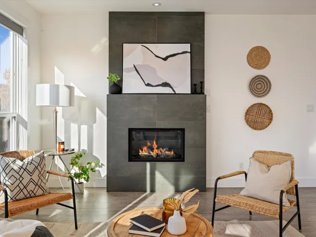 Living area featuring wood finished floors and a tile fireplace