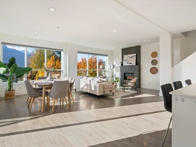Dining room featuring dark wood finished floors, recessed lighting, and a fireplace