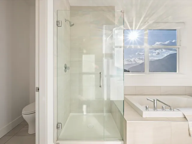 Full bathroom featuring a shower stall, tile patterned flooring, and a bath