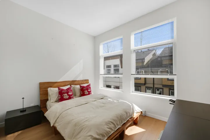 Bedroom featuring light wood-type flooring and baseboards