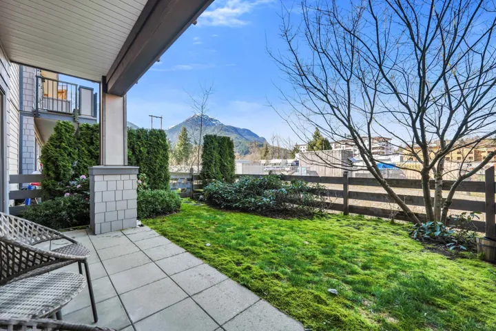 Fenced backyard with a patio area and a mountain view