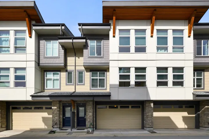 View of building exterior featuring an attached garage