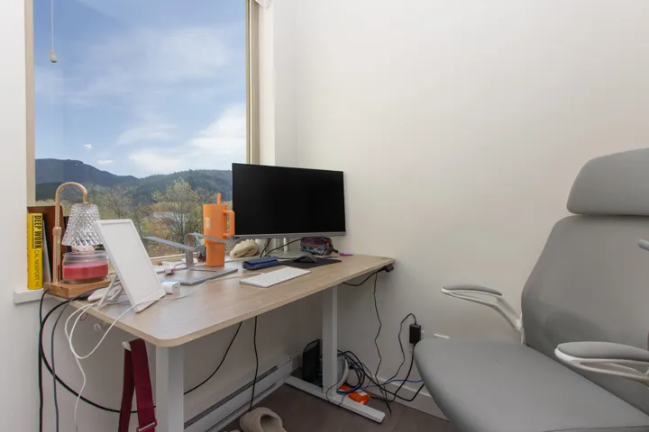 Office space with baseboards and wood finished floors