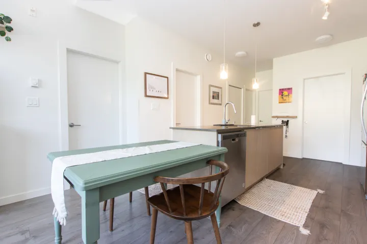 Dining room with baseboards and dark wood-style flooring