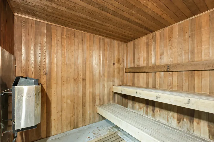 Sauna with wood walls and wood ceiling