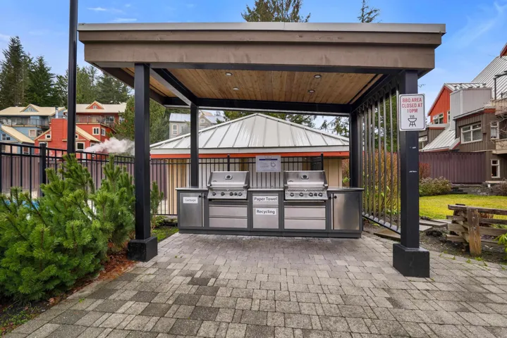 View of patio featuring area for grilling